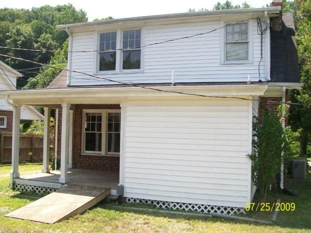 2672 Riverside Drive Bassett, VA 24055 - Photo 5 of 5 a view of a white house with a sink and a yard