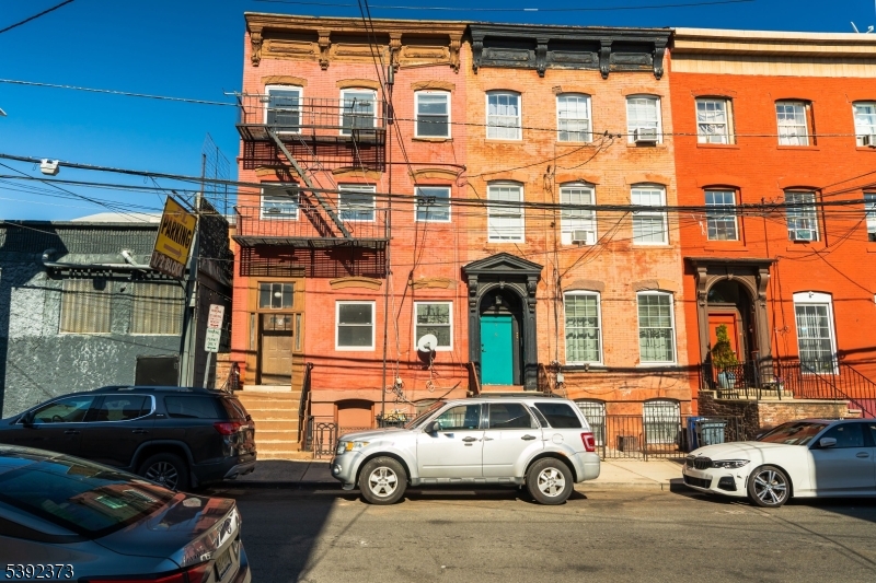 5 Elm Street, Unit 4 Newark, NJ 07102 - Photo 1 of 11 a car parked in front of a building