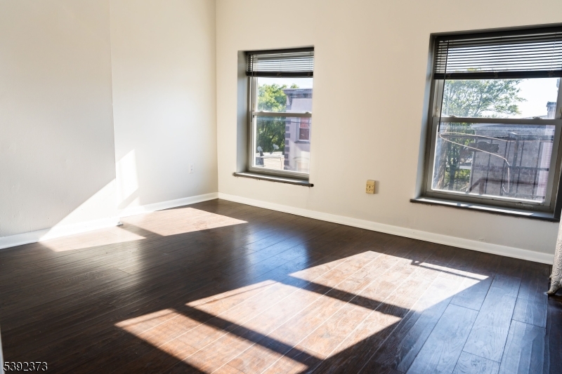 5 Elm Street, Unit 4 Newark, NJ 07102 - Photo 8 of 11 a view of a room with wooden floor and front door