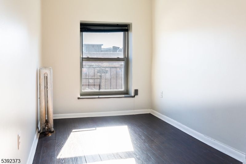 5 Elm Street, Unit 4 Newark, NJ 07102 - Photo 10 of 11 an empty room with a window