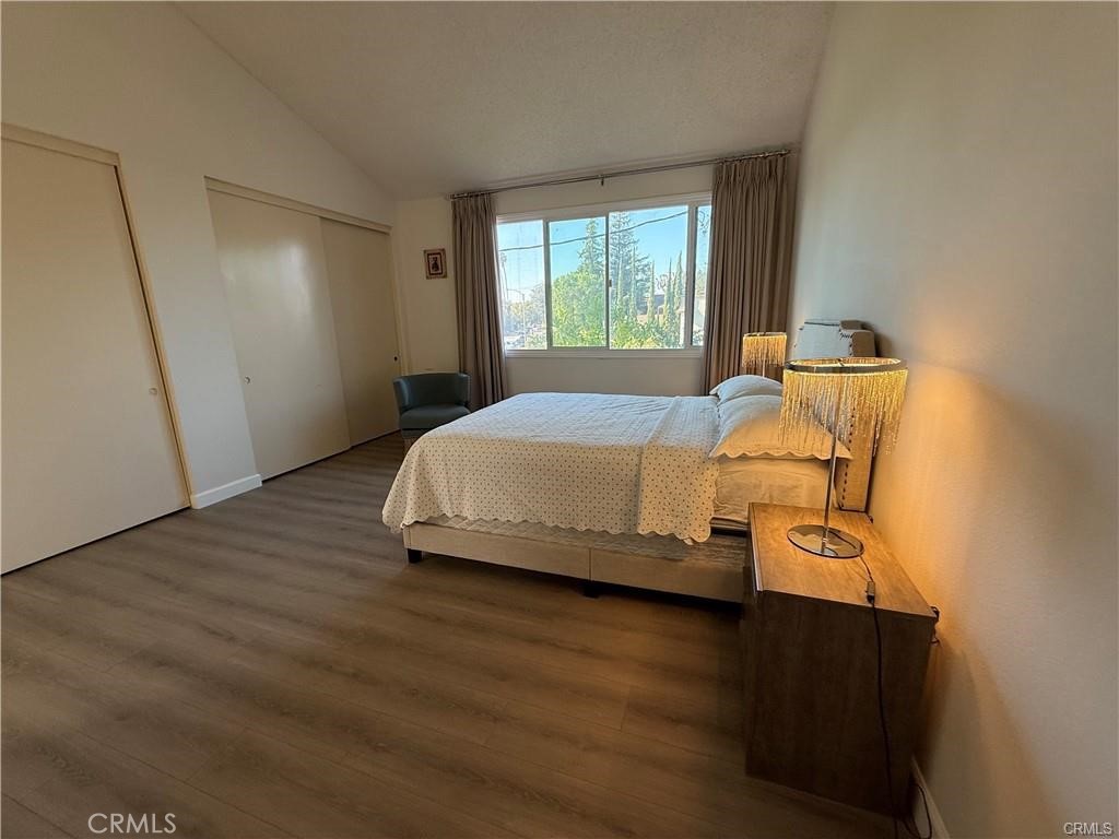 415 West Duarte Road Arcadia, CA 91007 - Photo 5 of 14 a bedroom with a bed and wooden floor