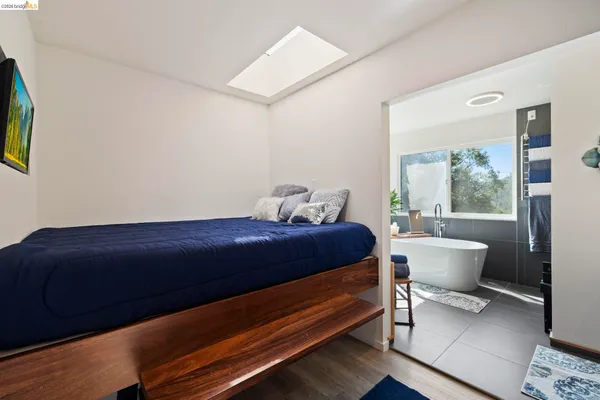a bedroom with a bed and window