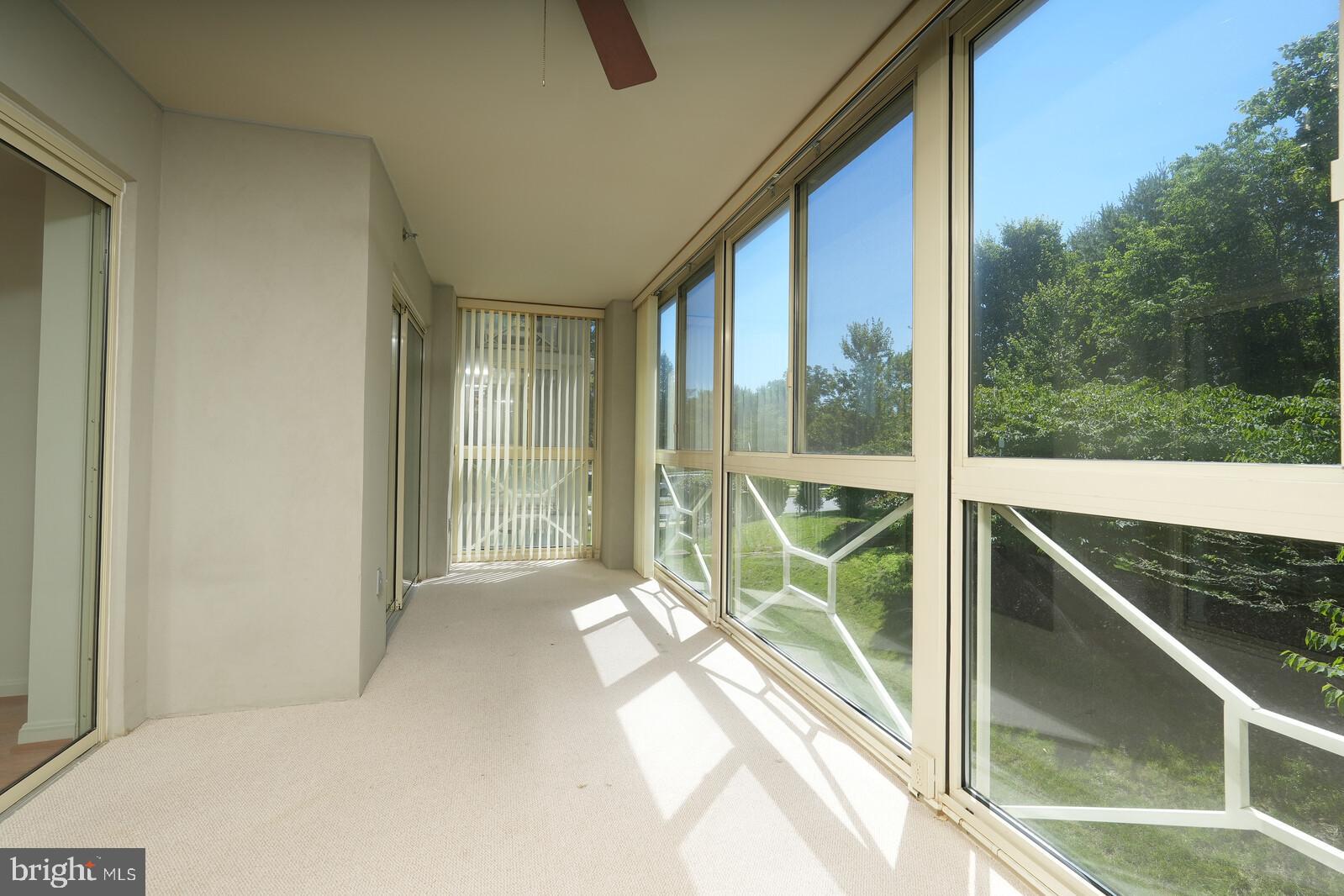 14800 Pennfield Circle, Unit 202 Silver Spring, MD 20906 - Photo 23 of 30 Large sunroom w/ access from living & guest room