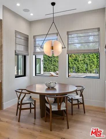 a dining room with a table and chairs