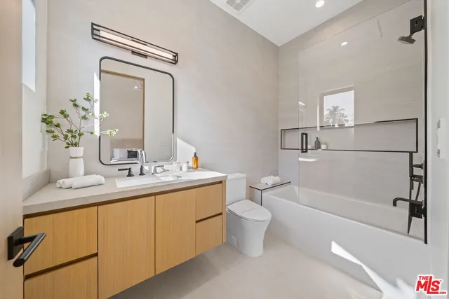 a bathroom with a toilet a sink and a bathtub