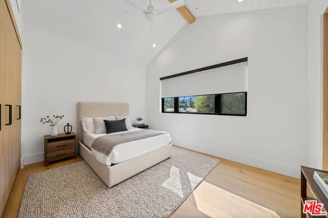 a room with a bed and a night stand