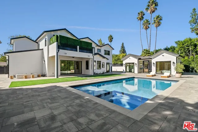 a view of pool with outdoor seating