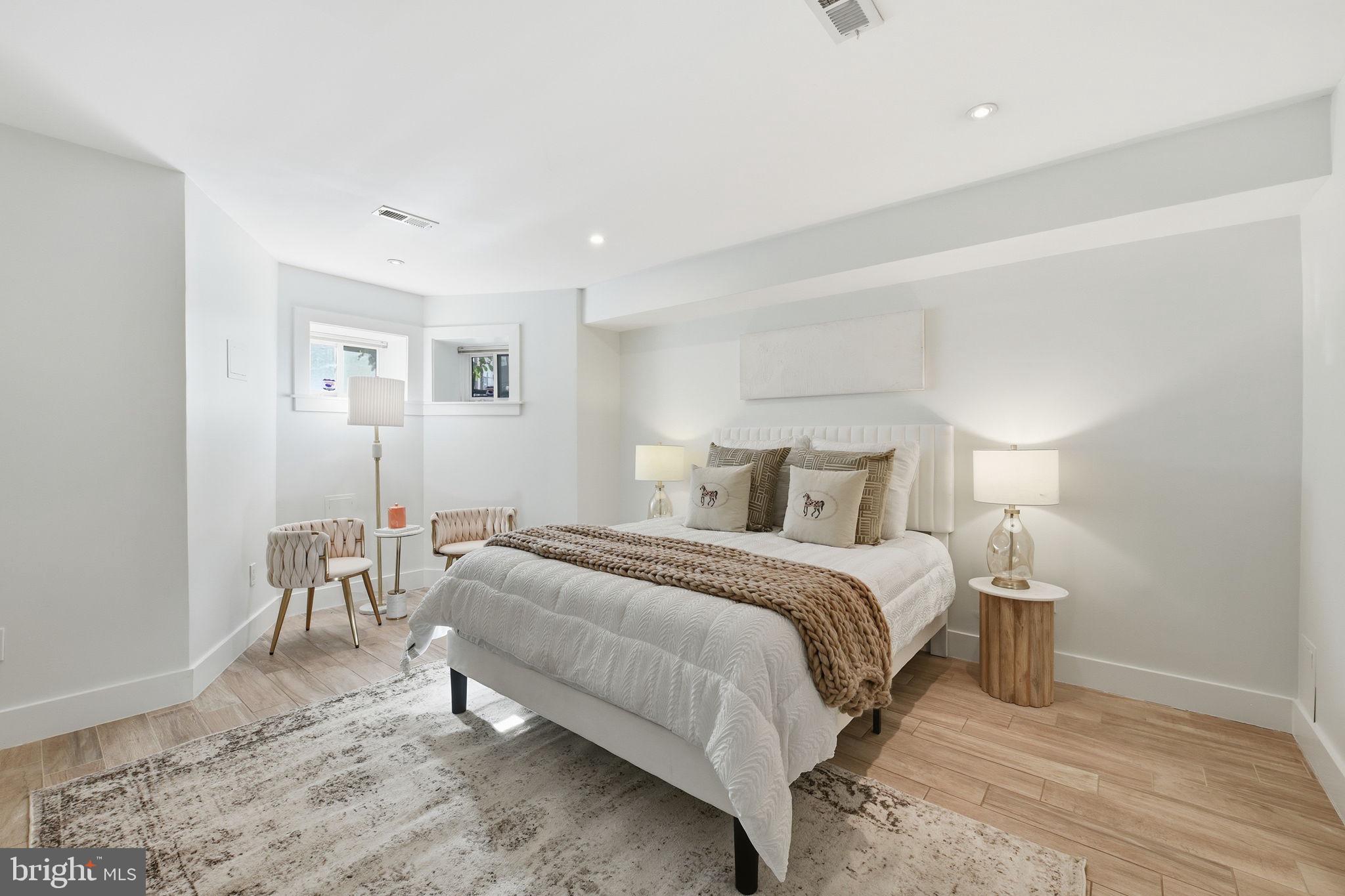 26 Q Street Northeast, Unit 1 Washington, DC 20002 - Photo 23 of 36 a bedroom with a bed and a table