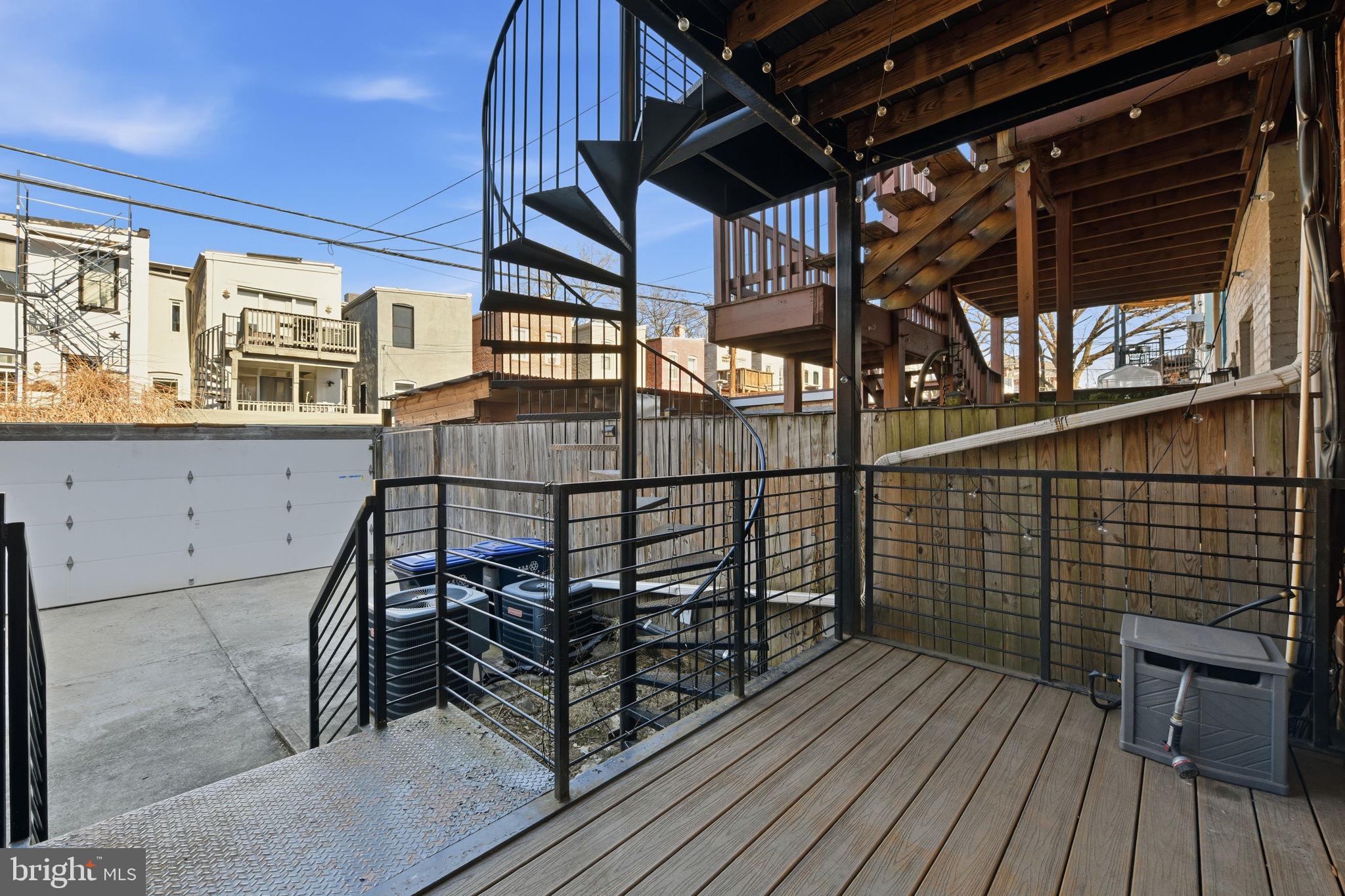 26 Q Street Northeast, Unit 1 Washington, DC 20002 - Photo 30 of 36 a view of a balcony with wooden floor