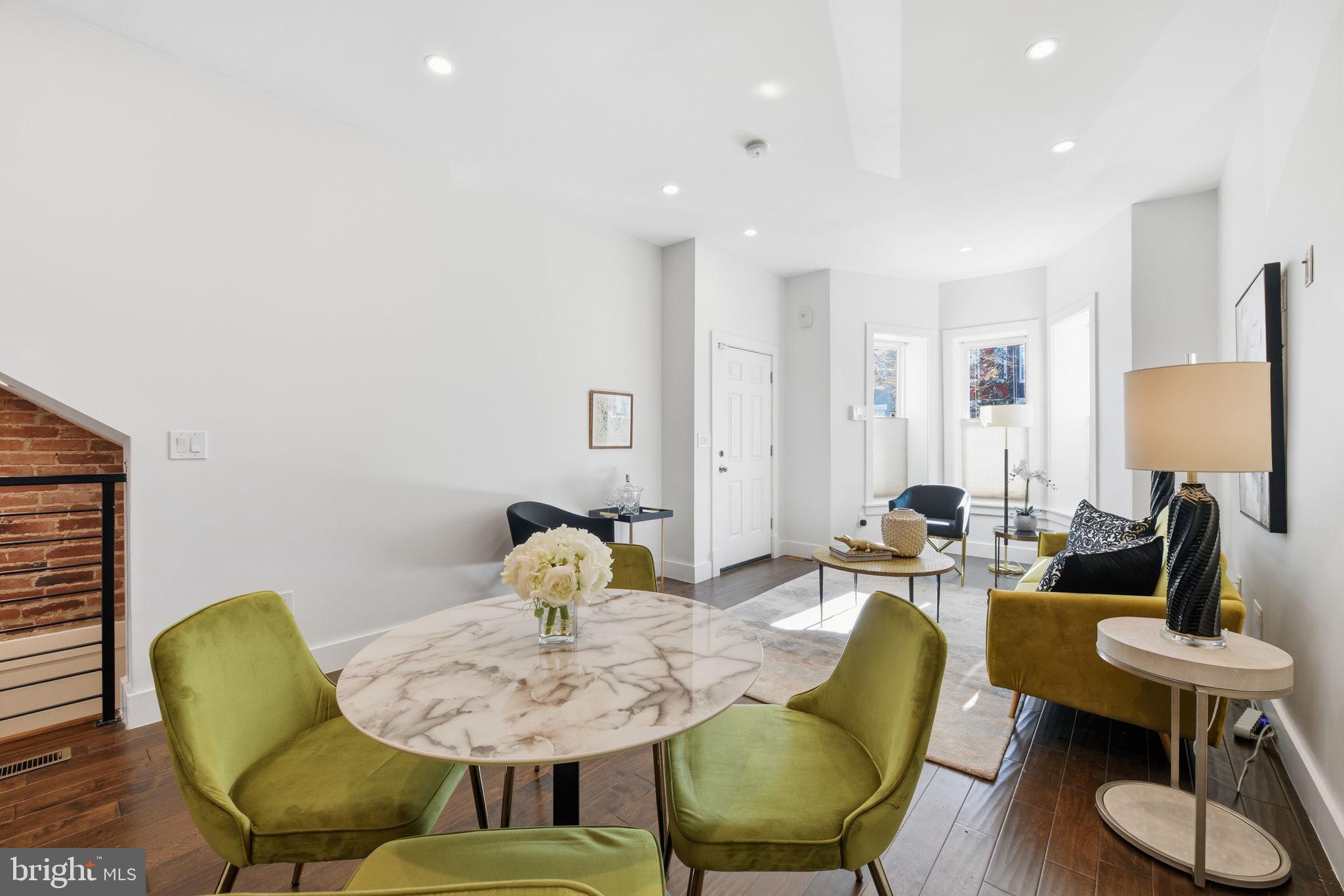 26 Q Street Northeast, Unit 1 Washington, DC 20002 - Photo 6 of 36 a living room with furniture and wooden floor