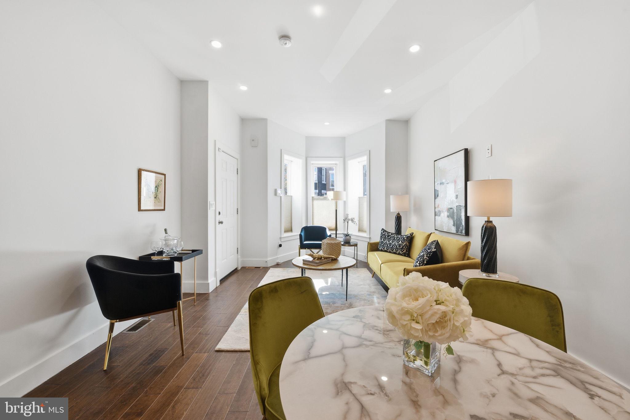 26 Q Street Northeast, Unit 1 Washington, DC 20002 - Photo 8 of 36 a living room with furniture