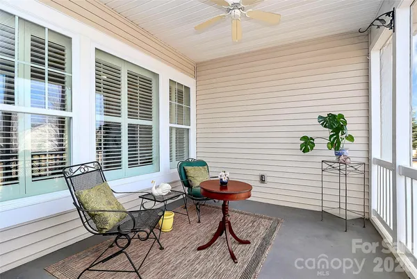 a view of a porch with furniture