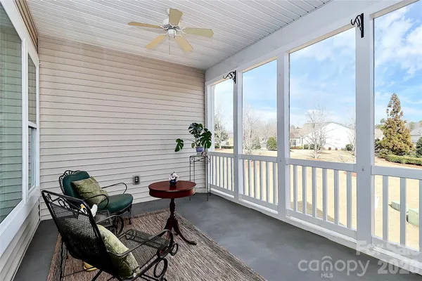 a view of a porch with furniture