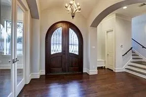 a view of front door with wooden floor