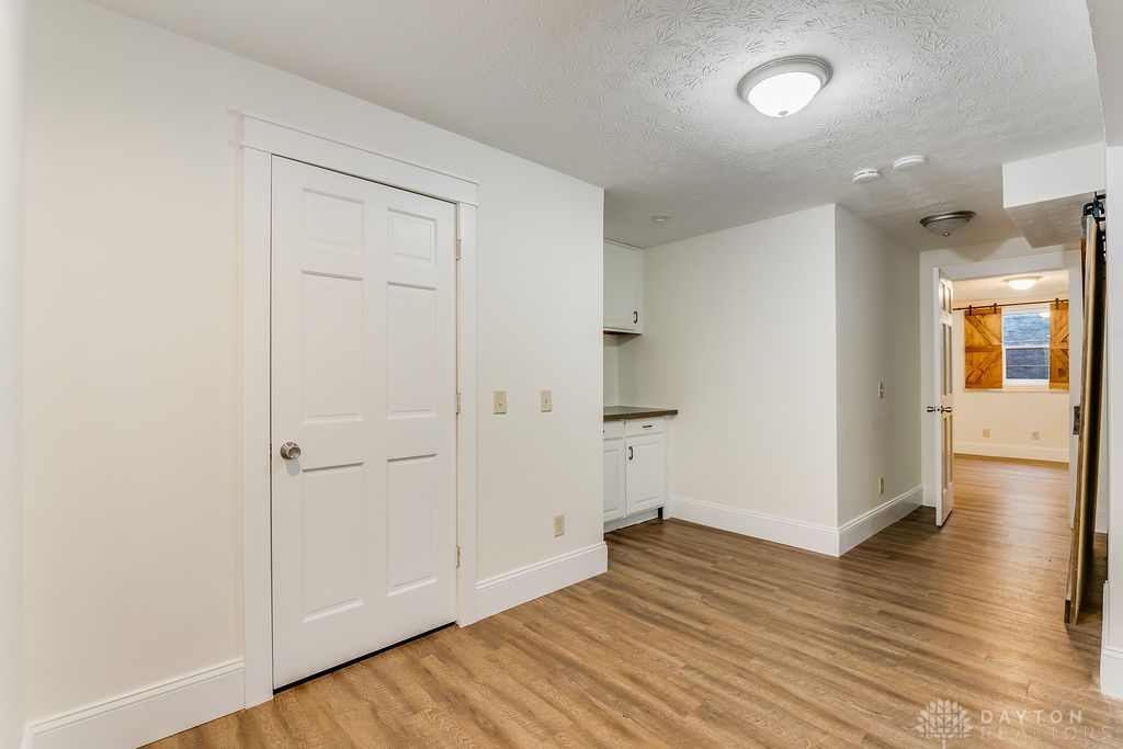 7400 Cook-Jones Road Waynesville, OH 45068 - Photo 48 of 72 This versatile room features durable flooring and functional cabinetry, ideal for various uses.