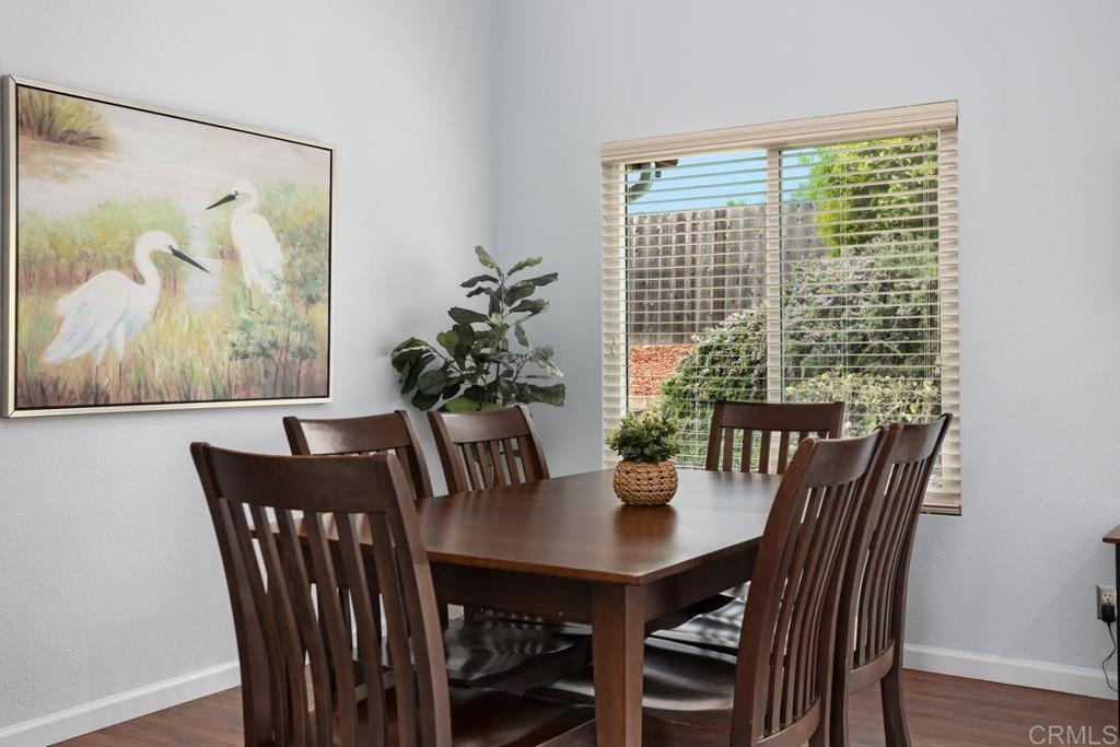 2075 Paseo De Anza Vista, CA 92084 - Photo 13 of 51 a view of a dining room with furniture window and wooden floor