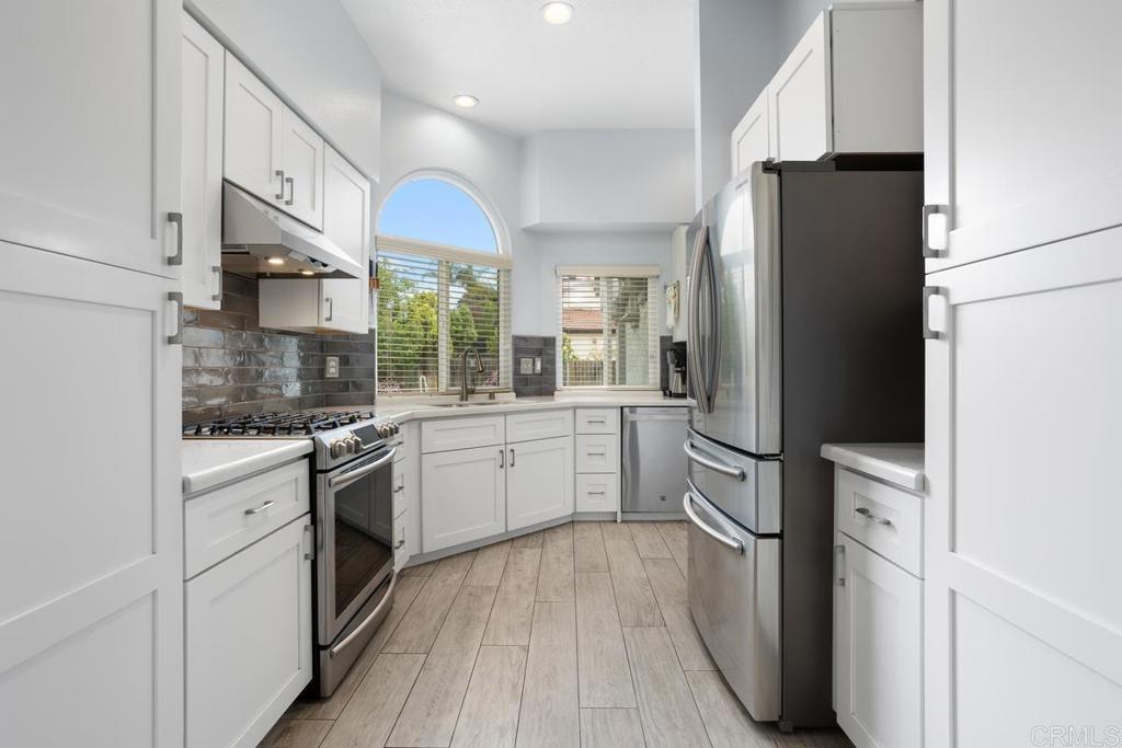 2075 Paseo De Anza Vista, CA 92084 - Photo 14 of 51 a kitchen with a refrigerator sink and stove