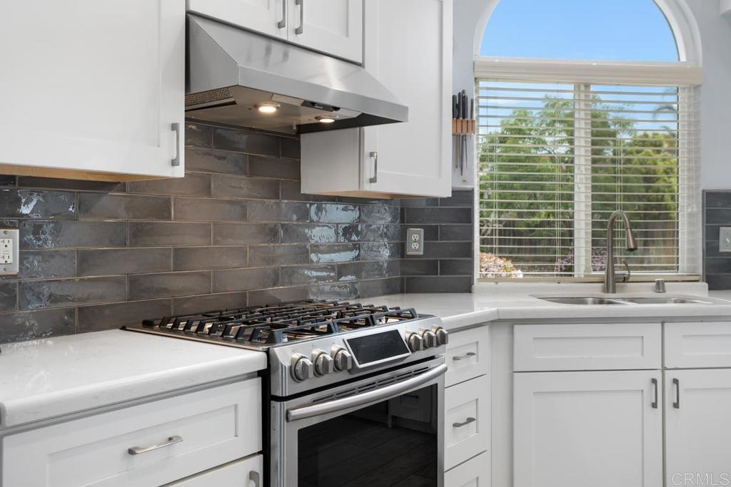 2075 Paseo De Anza Vista, CA 92084 - Photo 16 of 51 a kitchen with a stove and a sink