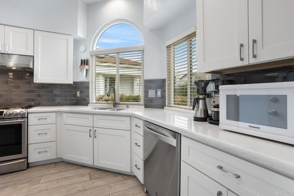 2075 Paseo De Anza Vista, CA 92084 - Photo 17 of 51 a kitchen with cabinets appliances and a sink
