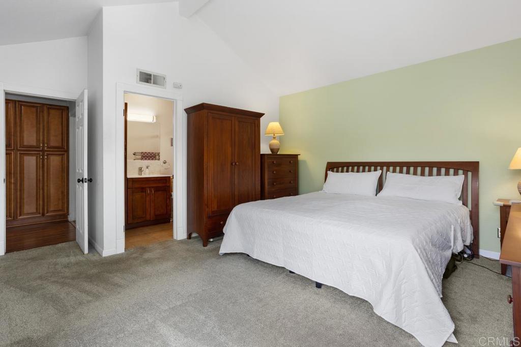 2075 Paseo De Anza Vista, CA 92084 - Photo 24 of 51 a bedroom with a bed and cabinets