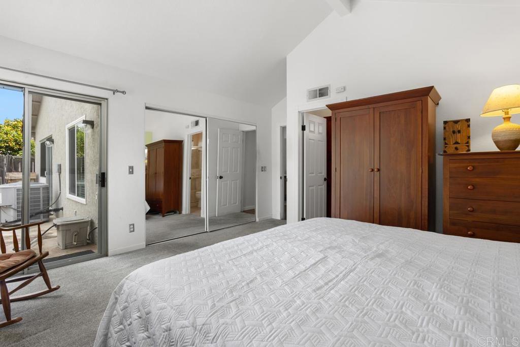 2075 Paseo De Anza Vista, CA 92084 - Photo 25 of 51 a bedroom with a bed and a large mirror in it