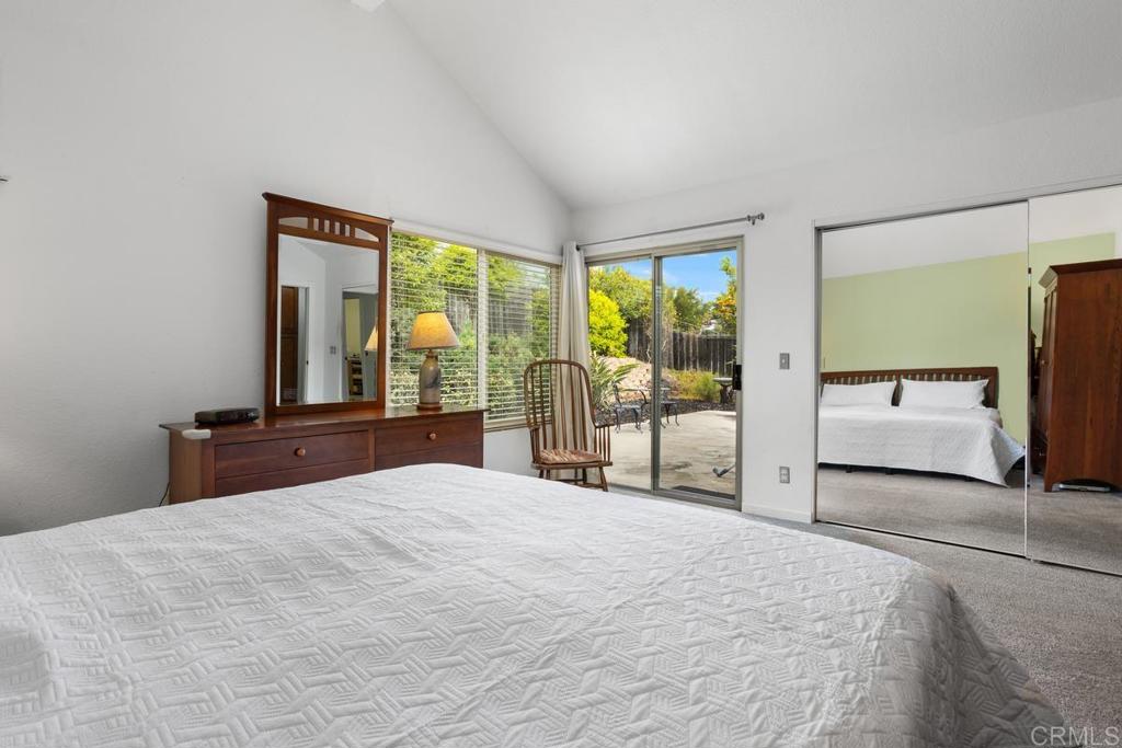 2075 Paseo De Anza Vista, CA 92084 - Photo 26 of 51 a bedroom with a large bed and a large window