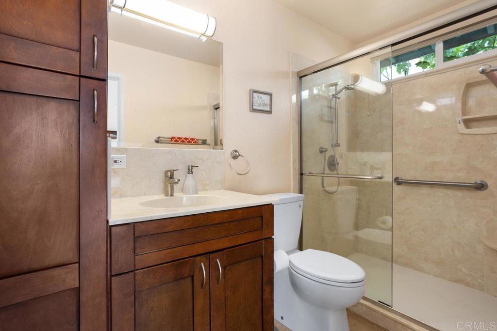 2075 Paseo De Anza Vista, CA 92084 - Photo 27 of 51 a bathroom with a sink toilet and shower