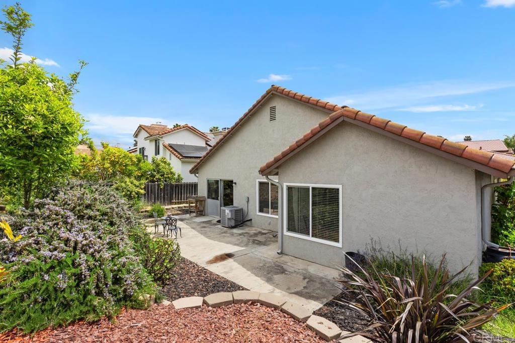 2075 Paseo De Anza Vista, CA 92084 - Photo 31 of 51 a view of a house with backyard and sitting area