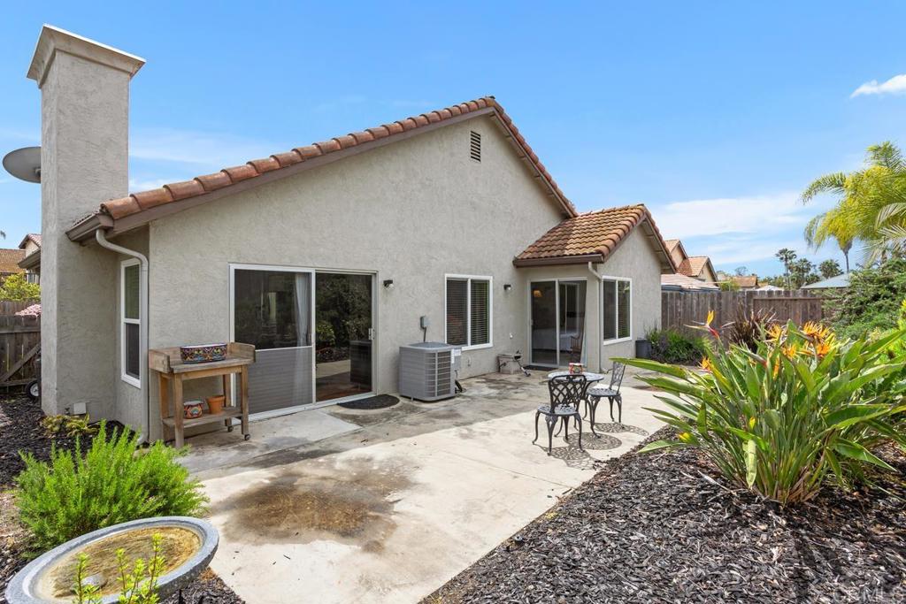 2075 Paseo De Anza Vista, CA 92084 - Photo 33 of 51 a front view of house with yard outdoor seating and barbeque oven