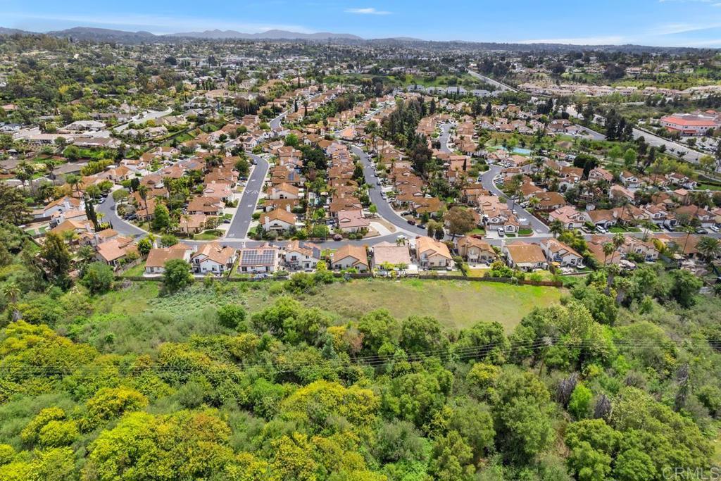2075 Paseo De Anza Vista, CA 92084 - Photo 36 of 51 an aerial view of residential houses with outdoor space and trees