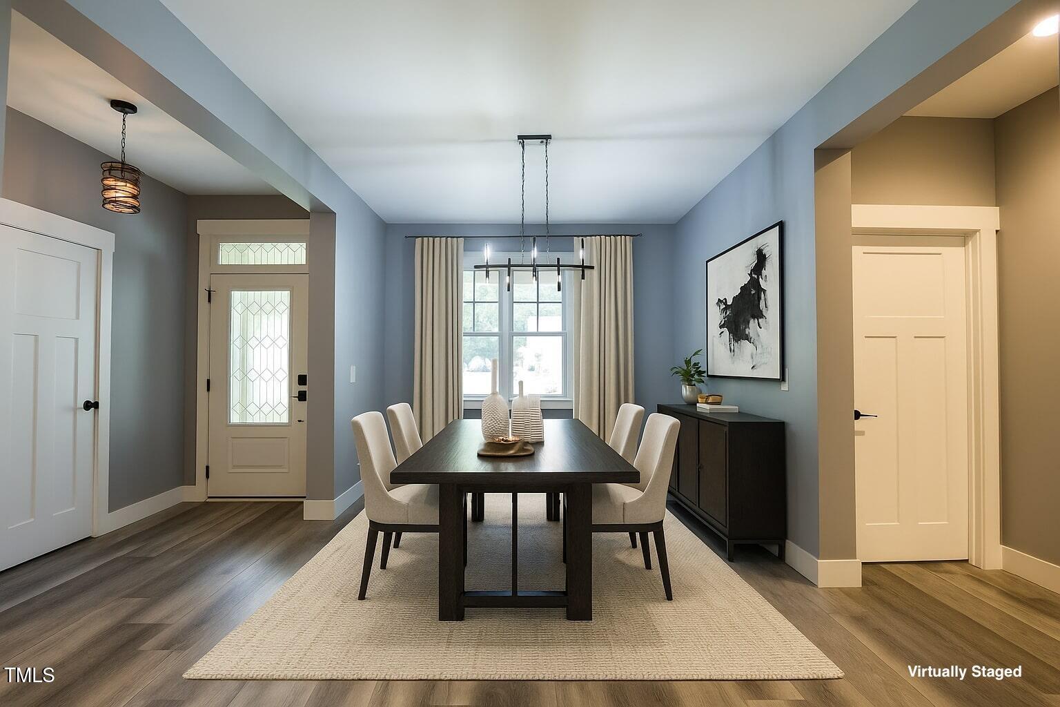 77 Running Deer Path Timberlake, NC 27583 - Photo 14 of 41 a dining room with furniture a chandelier and wooden floor