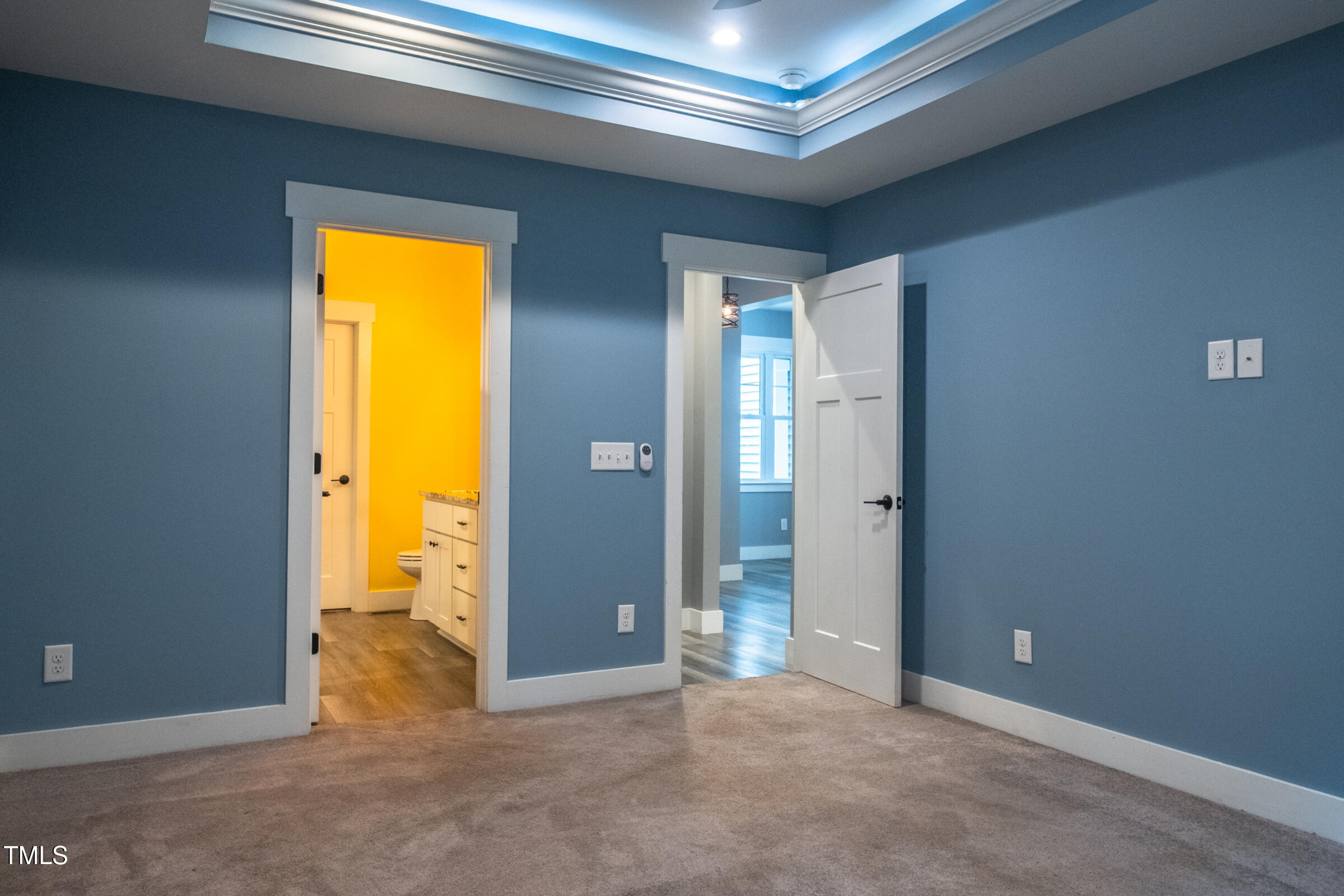 77 Running Deer Path Timberlake, NC 27583 - Photo 21 of 41 an empty room with a bathroom and a hallway