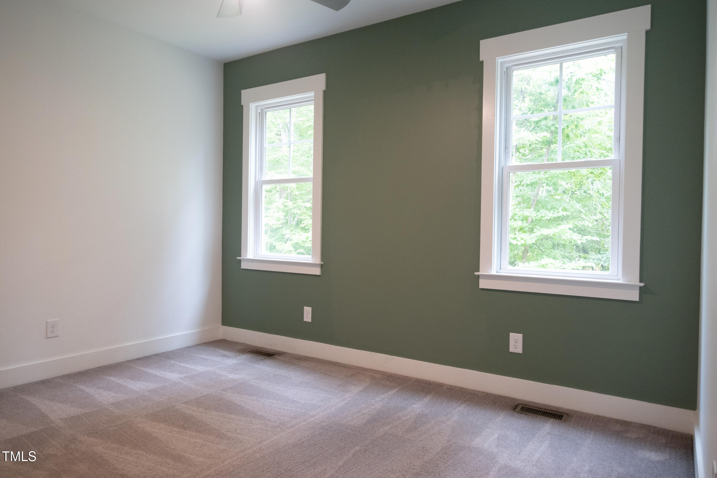 77 Running Deer Path Timberlake, NC 27583 - Photo 25 of 41 an empty room with a window and a dresser
