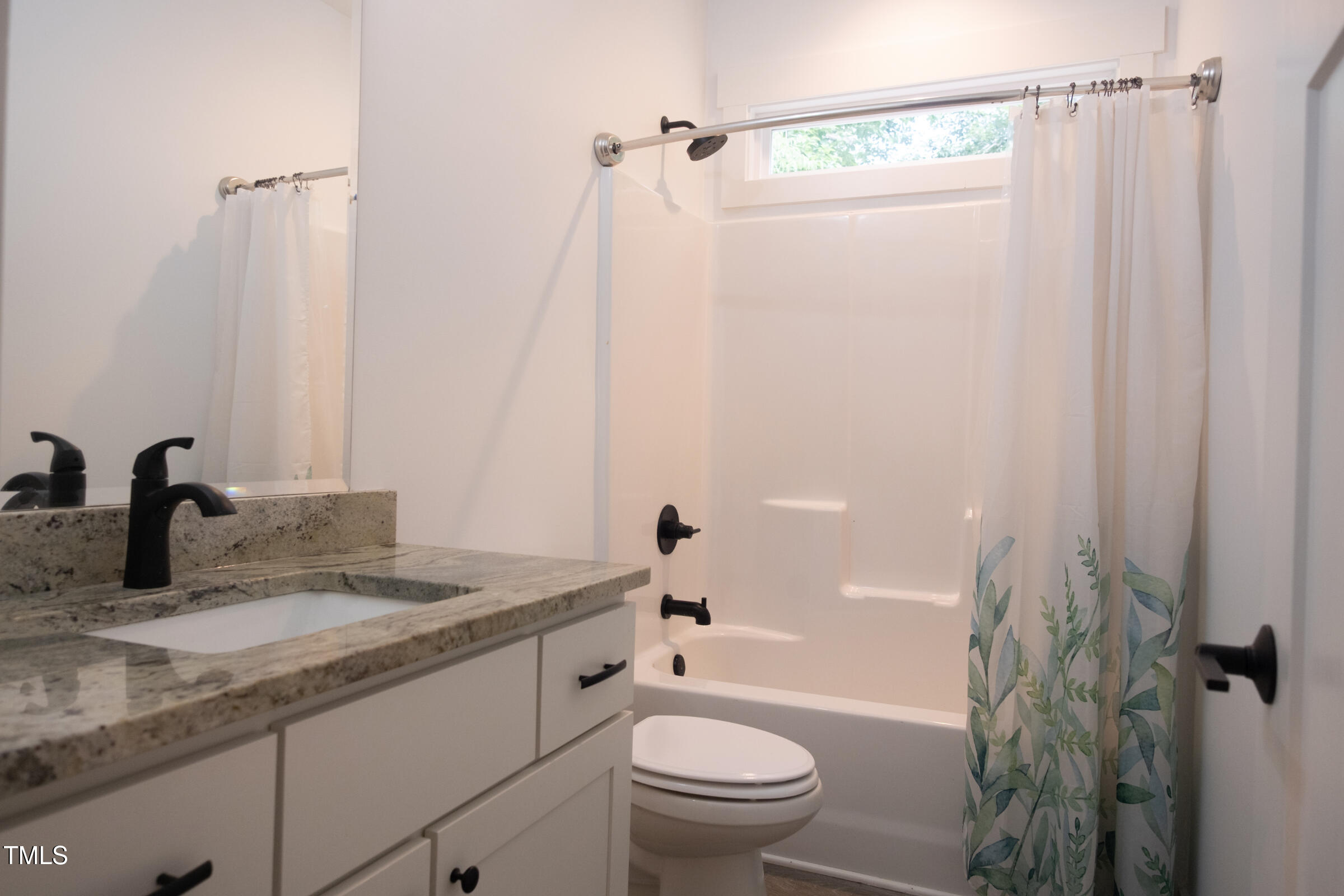 77 Running Deer Path Timberlake, NC 27583 - Photo 28 of 41 a bathroom with a granite countertop sink toilet and shower