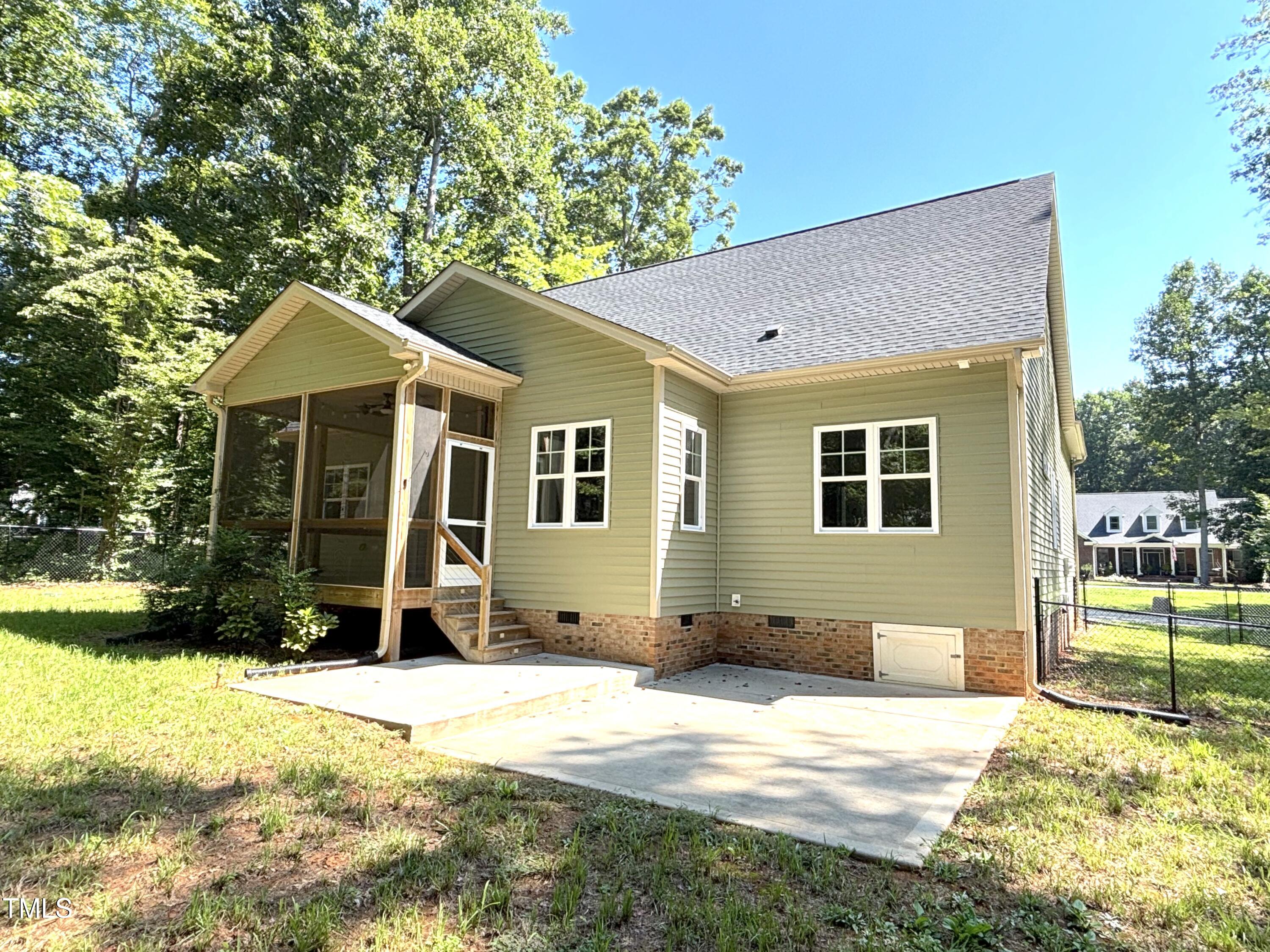77 Running Deer Path Timberlake, NC 27583 - Photo 3 of 41 a front view of a house with a yard