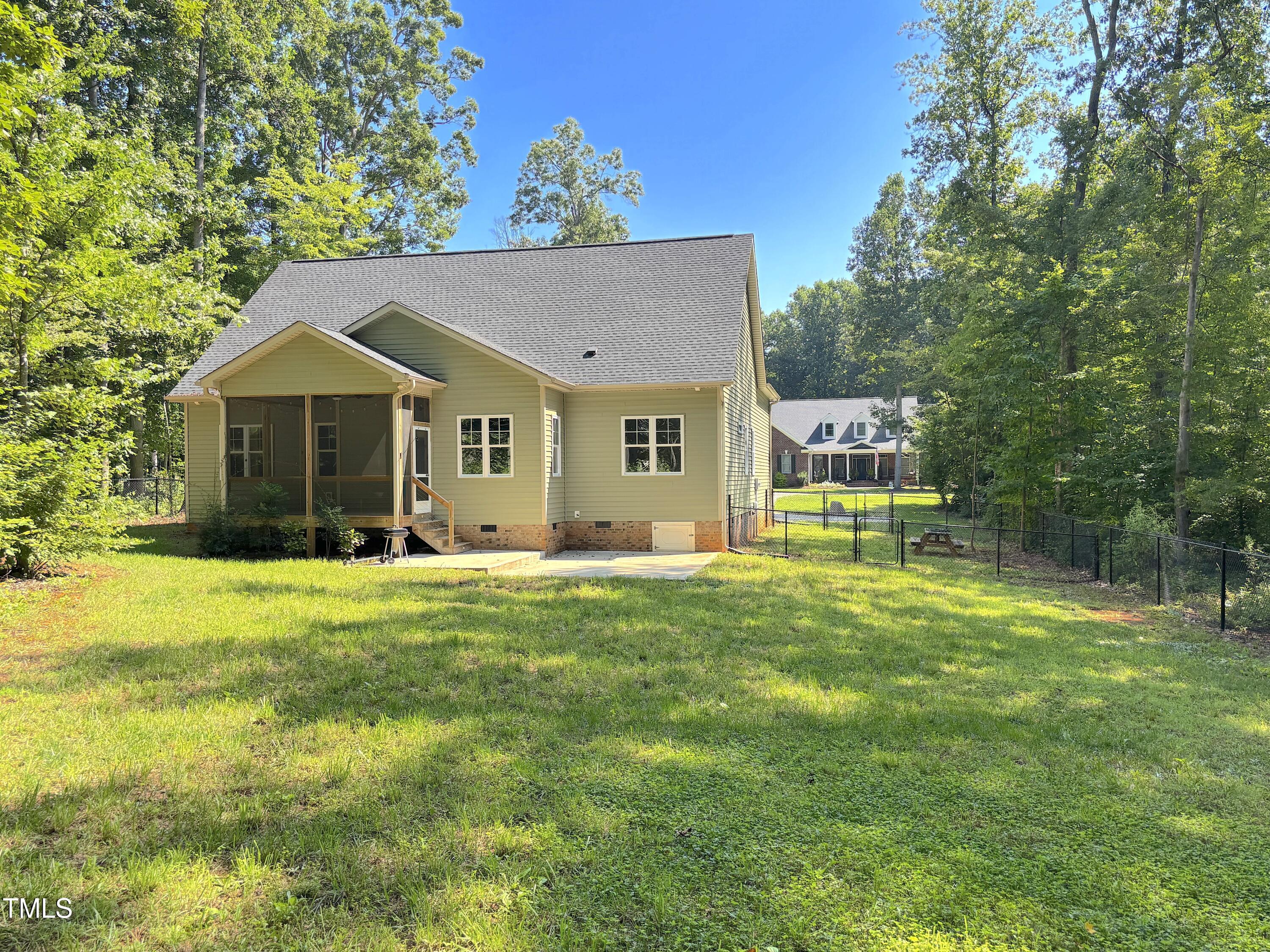 77 Running Deer Path Timberlake, NC 27583 - Photo 4 of 41 a house view with a garden space