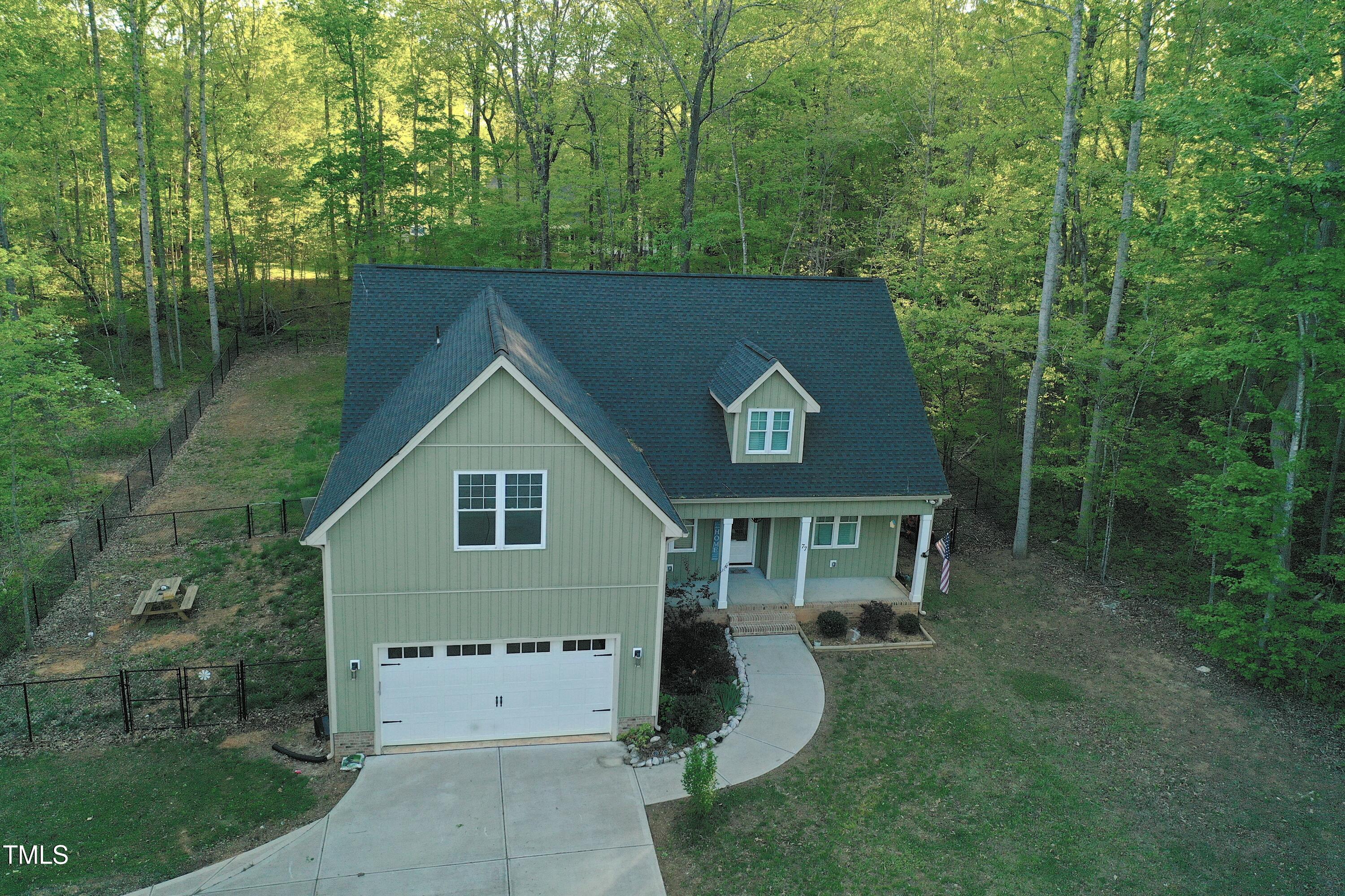 77 Running Deer Path Timberlake, NC 27583 - Photo 6 of 41 front view of a house with a yard