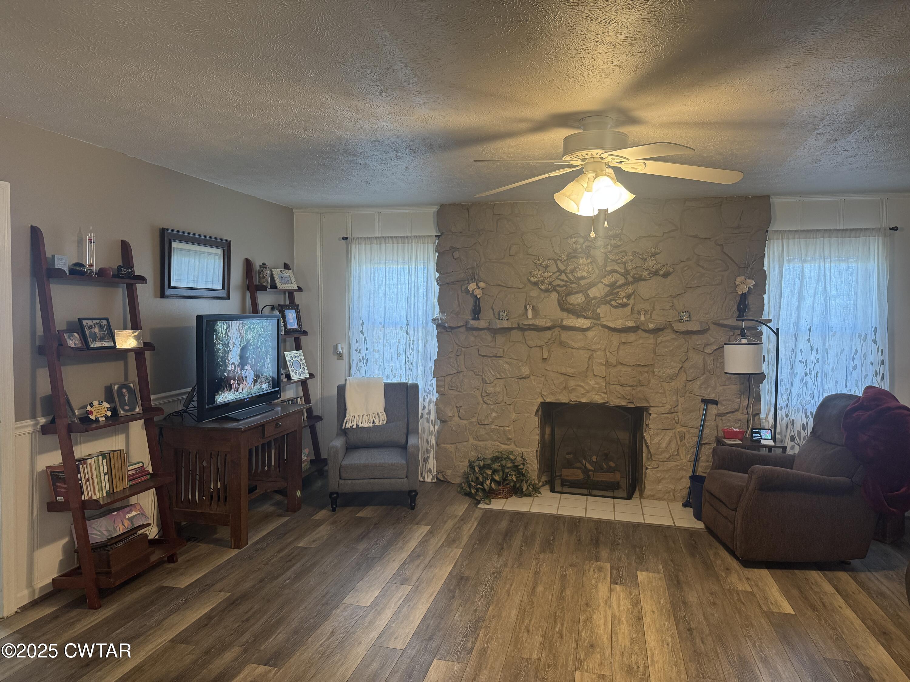 2685 Sunshine Road Henderson, TN 38340 - Photo 11 of 36 a living room with furniture and a fireplace