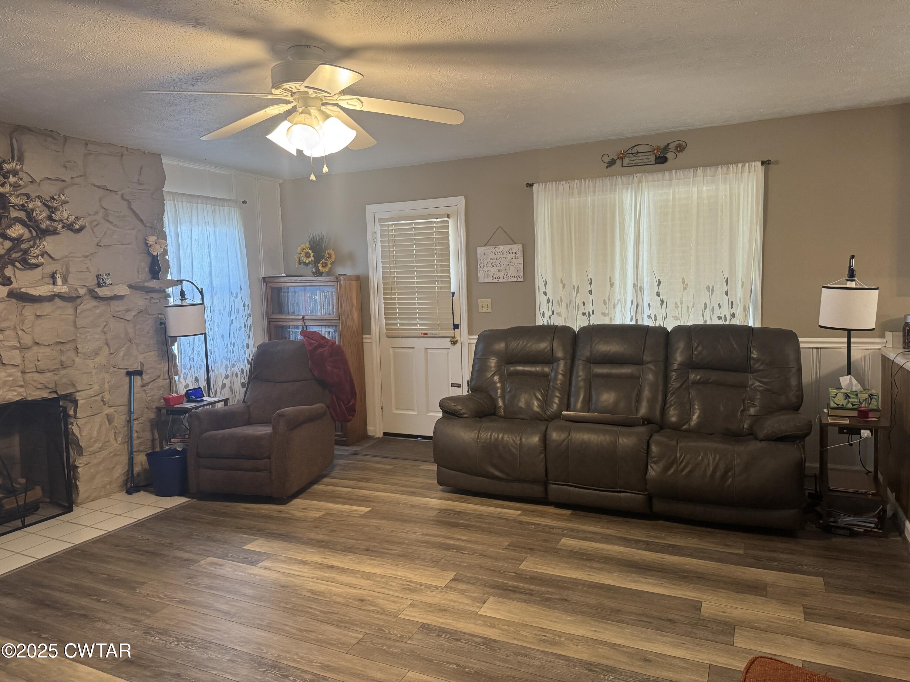 2685 Sunshine Road Henderson, TN 38340 - Photo 15 of 36 a living room with furniture and a fireplace