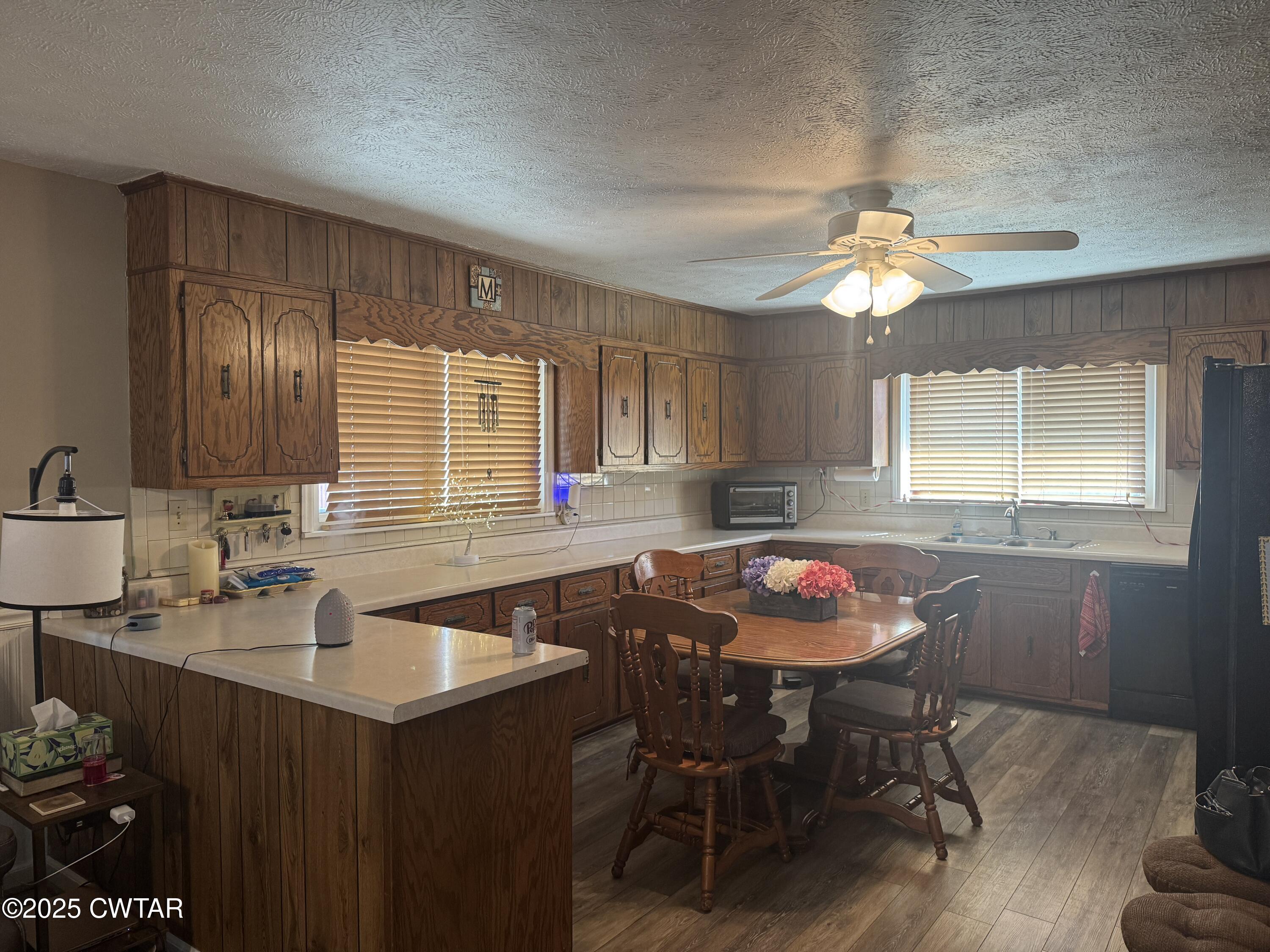2685 Sunshine Road Henderson, TN 38340 - Photo 17 of 36 a kitchen with stainless steel appliances a table chairs and chandelier