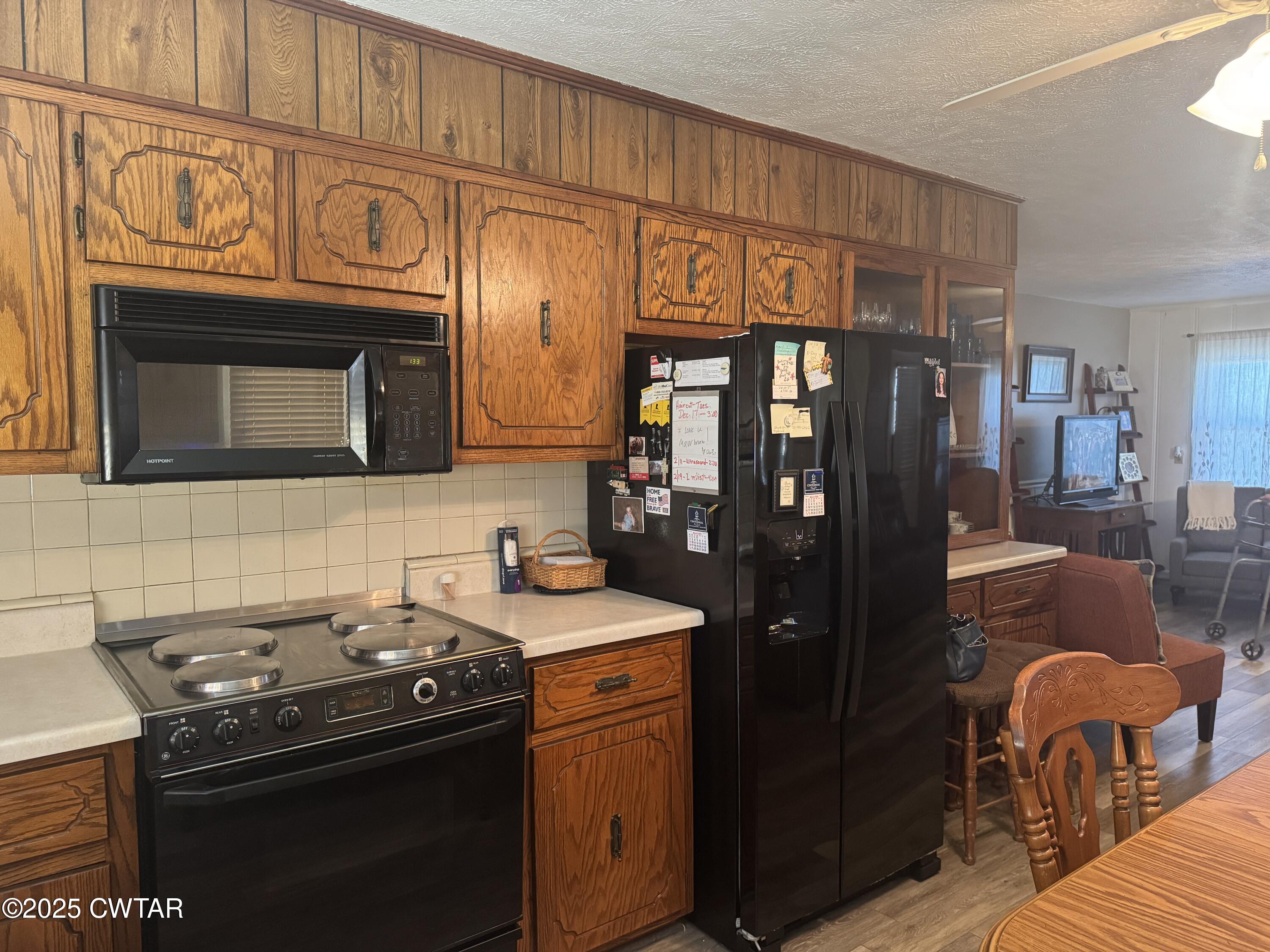2685 Sunshine Road Henderson, TN 38340 - Photo 19 of 36 a kitchen with stainless steel appliances granite countertop a stove refrigerator and cabinets