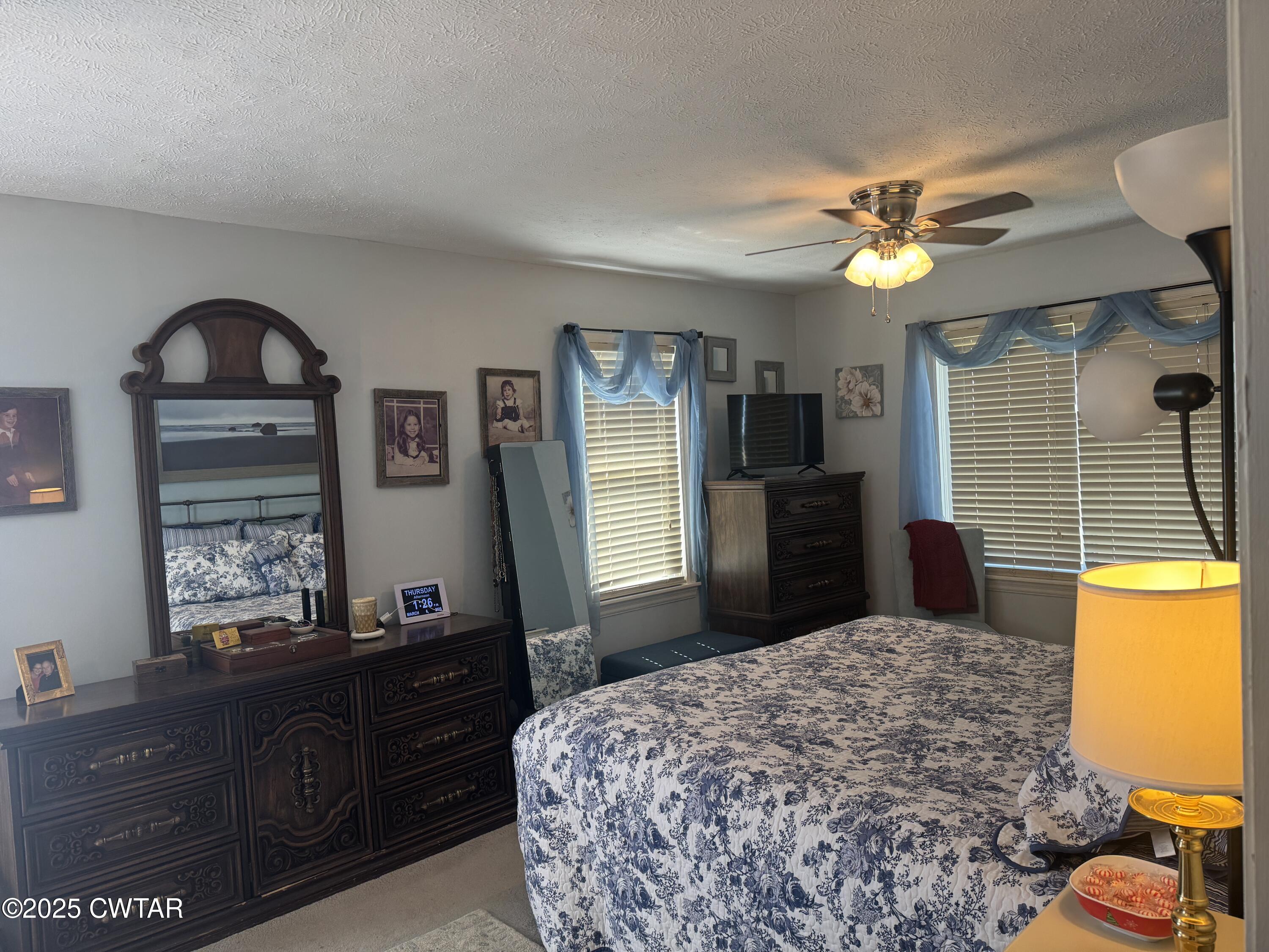 2685 Sunshine Road Henderson, TN 38340 - Photo 26 of 36 a bedroom with a bed and a dresser