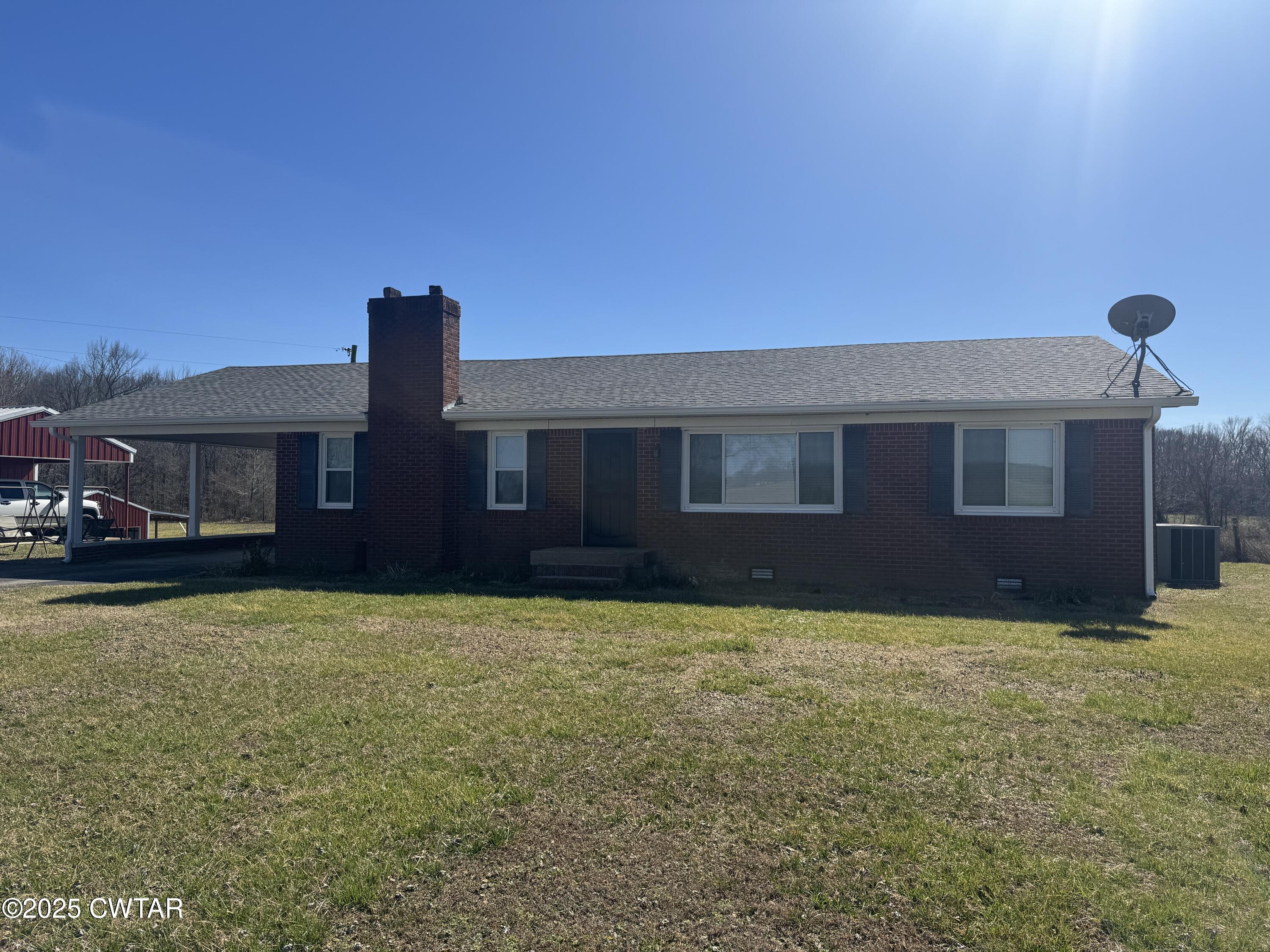 2685 Sunshine Road Henderson, TN 38340 - Photo 2 of 36 a view of a house with a yard