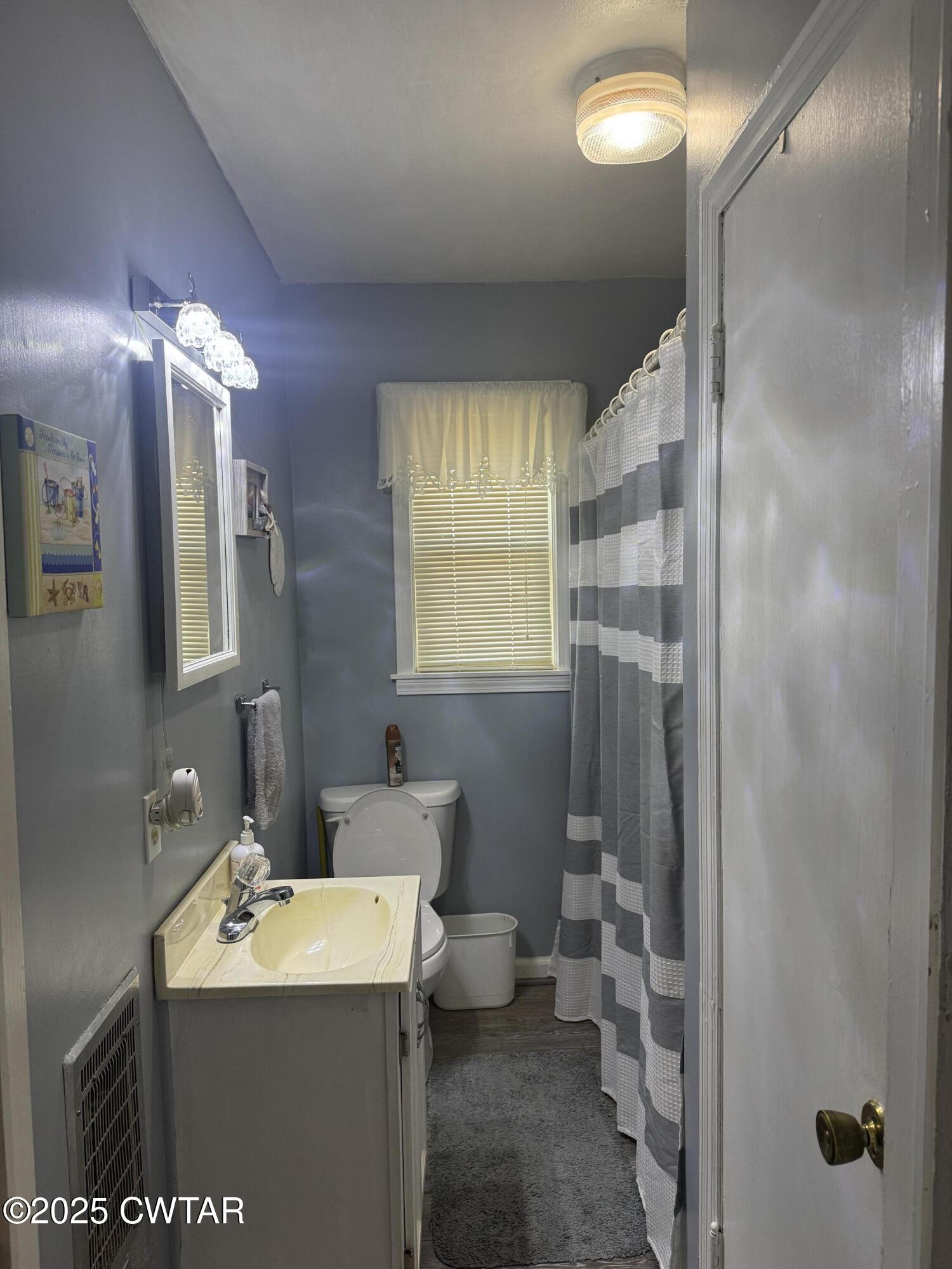2685 Sunshine Road Henderson, TN 38340 - Photo 35 of 36 a bathroom with a sink toilet and shower