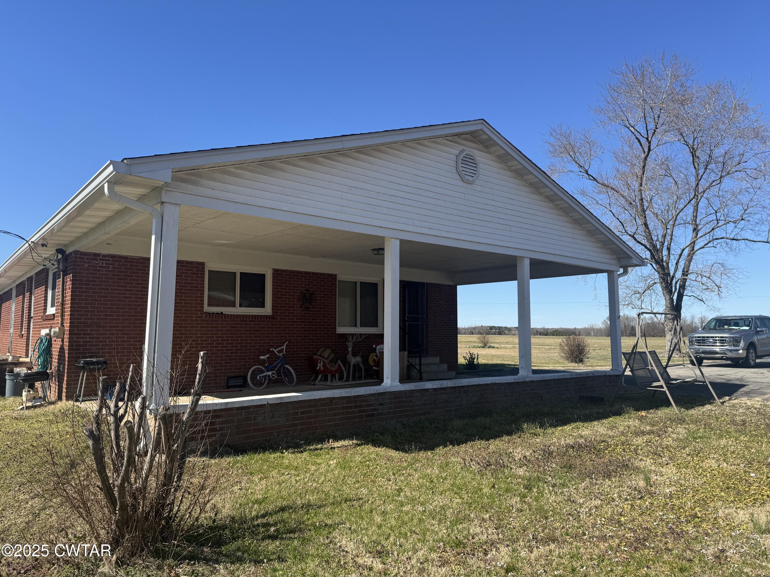 2685 Sunshine Road Henderson, TN 38340 - Photo 3 of 36 a view of a house with a yard