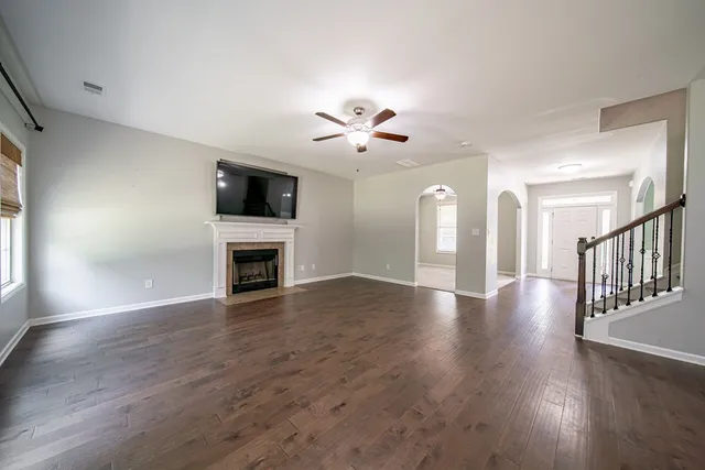 a large kitchen with stainless steel appliances granite countertop a sink stove and refrigerator