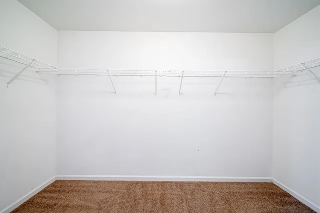 a view of a hallway with stairs