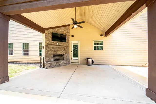 a view of a yard with swimming pool