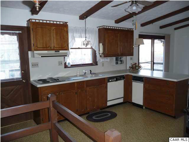 1 Stonefield Road Palmyra, VA 22963 - Photo 8 of 23 a kitchen with stainless steel appliances granite countertop a sink stove and microwave
