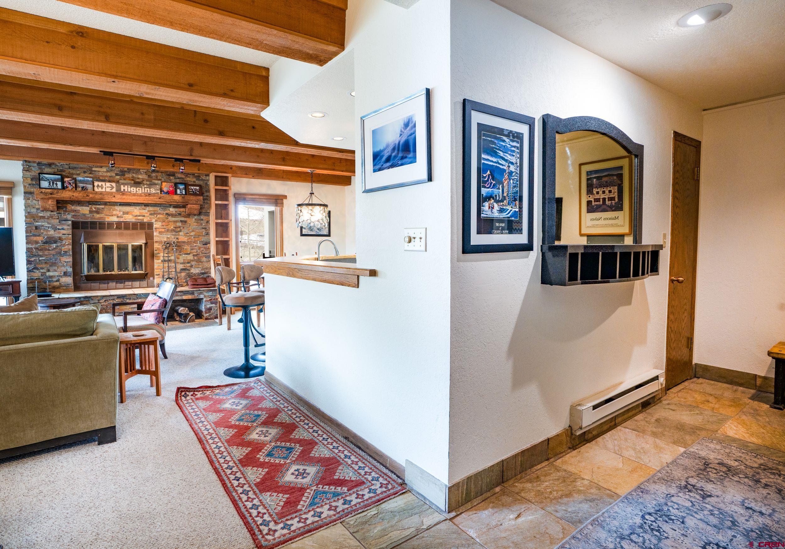 11 Snowmass Road, Unit 440 Crested Butte, CO 81225 - Photo 24 of 41 a living room with furniture and large window
